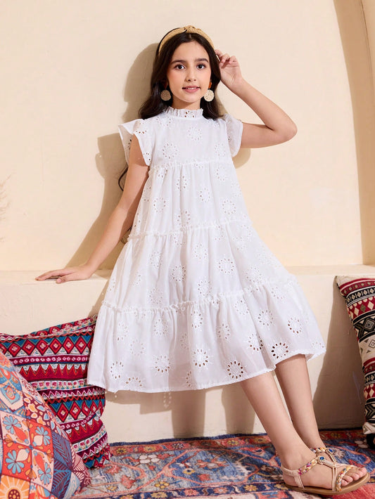 Vestido de vacaciones de línea A con cuello alto de tela con textura perforada. Temporada primavera/verano