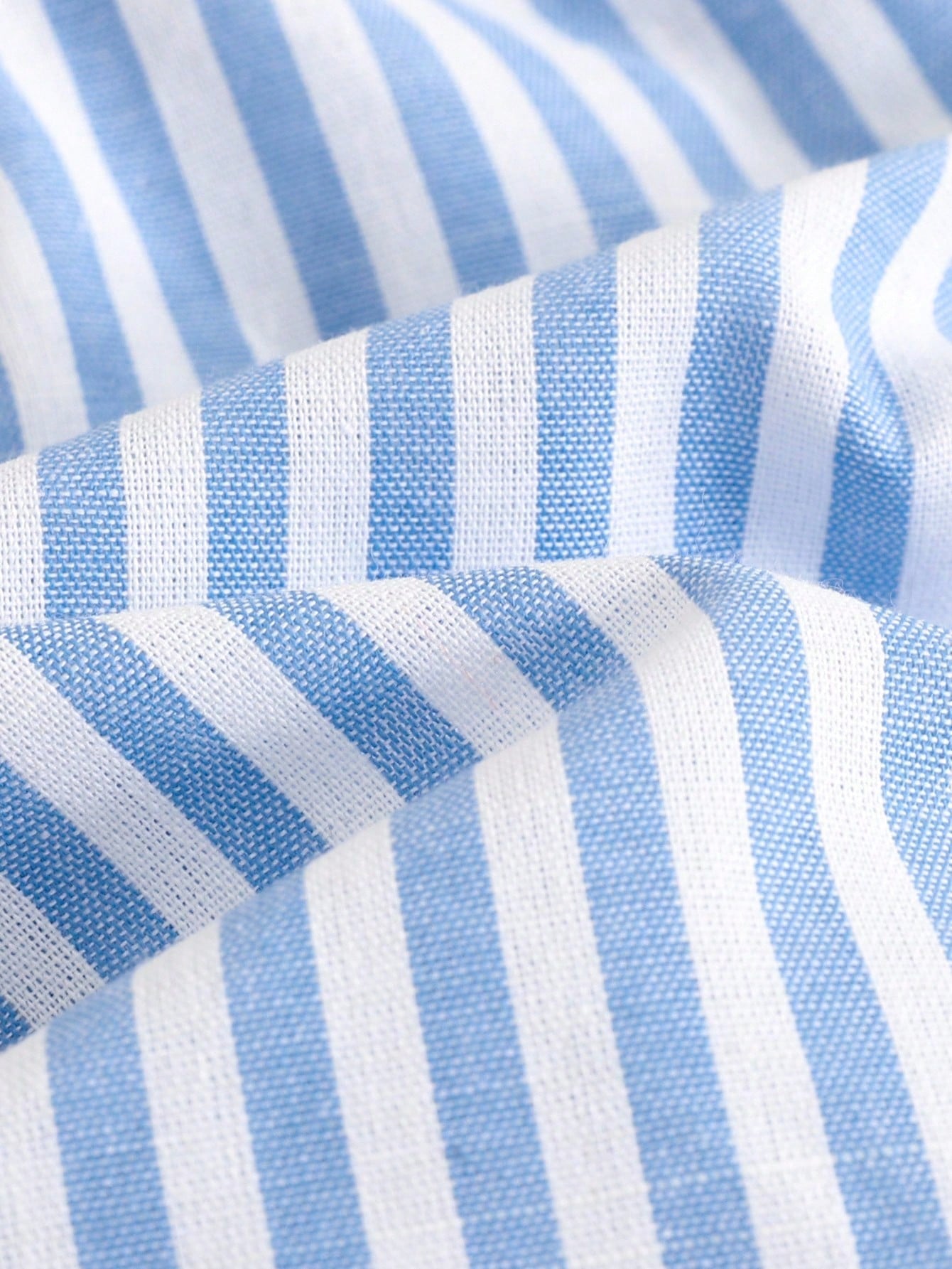 Conjunto de top de tirantes de tela a rayas azul y blanco con empalme y pantalones de pierna ancha